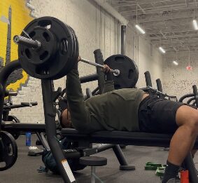 Barbell bench press during an APX Fitness session
