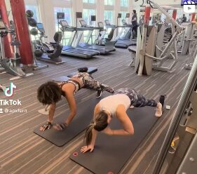 APX Fitness clients holding a plank during a group session