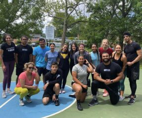 APX Fitness group session on an outdoor court