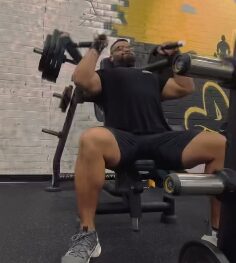 Incline dumbbell press during an APX Fitness training session
